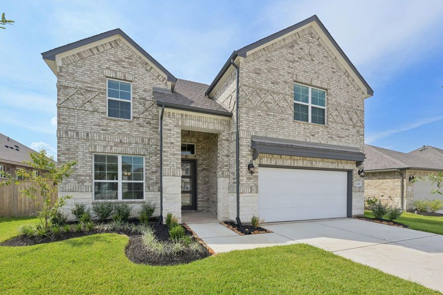 Front exterior of a new home in Kingdom Heights, Rosenberg, TX, highlighting curb appeal (Image 24). Front exterior of a new home in Kingdom Heights, Rosenberg, TX, highlighting curb appeal (Image 24).