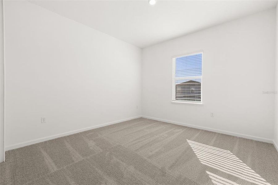 Spacious, unfurnished interior of a new home in Serenade at Ovation, Winter Garden (Image 22).