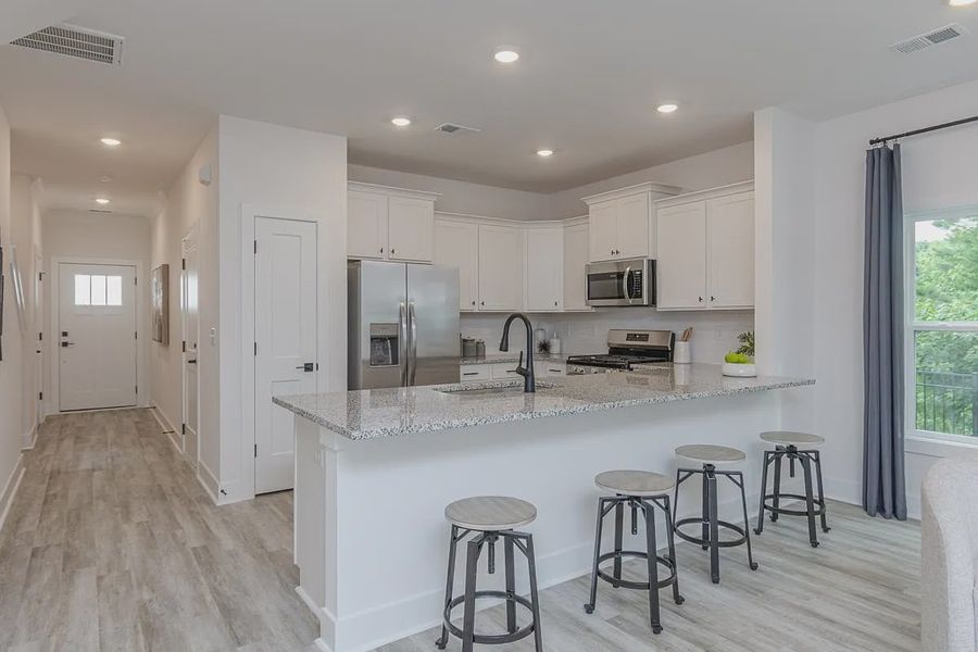 Representative furnished interior of a home built from the 1557 Townhome by Adams Homes in Parkstone Place Townhomes, Roebuck (Image 7).