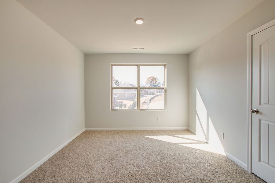 Representative unfurnished interior of a home built from the HAYDEN by D.R. Horton in The Parks, White House (Image 17).