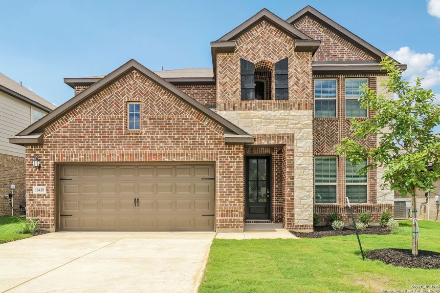 Front exterior of a new home in Fox Falls, Boerne, TX, highlighting curb appeal (Image 26).