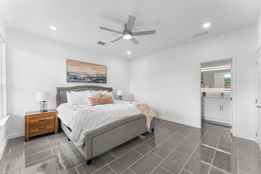 Bedroom with a ceiling fan, recessed lighting, and ensuite bathroom Bedroom with a ceiling fan, recessed lighting, and ensuite bathroom