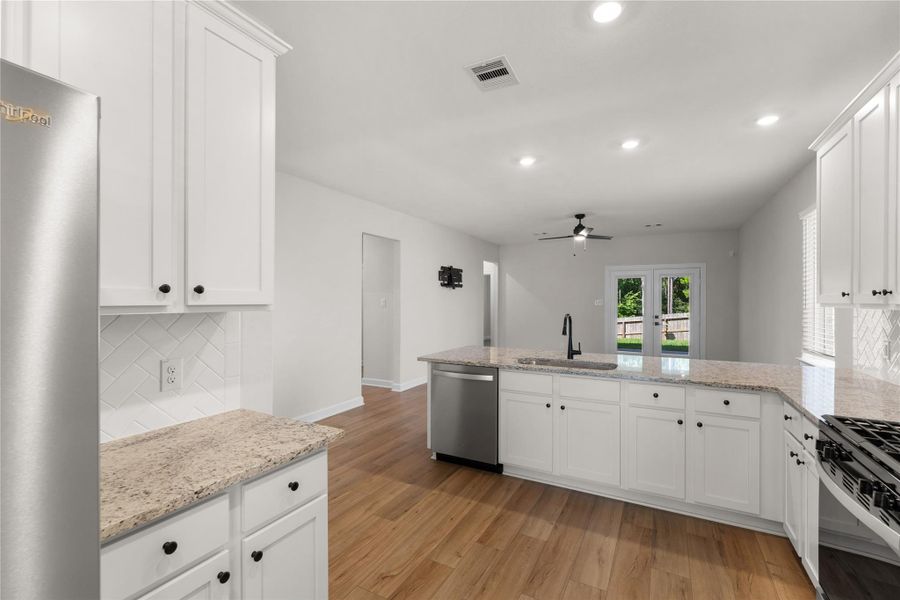 Well-appointed kitchen with granite countertops, stainless steel appliances, generous cabinetry, and a functional open layout. Designed for both everyday convenience and effortless entertaining Well-appointed kitchen with granite countertops, stainless steel appliances, generous cabinetry, and a functional open layout. Designed for both everyday convenience and effortless entertaining
