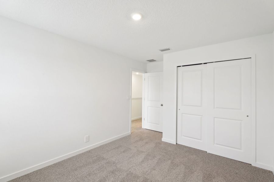 Spacious, unfurnished interior of a new home in Lakes at Bella Lago - Signature Series, Green Cove Springs (Image 8).