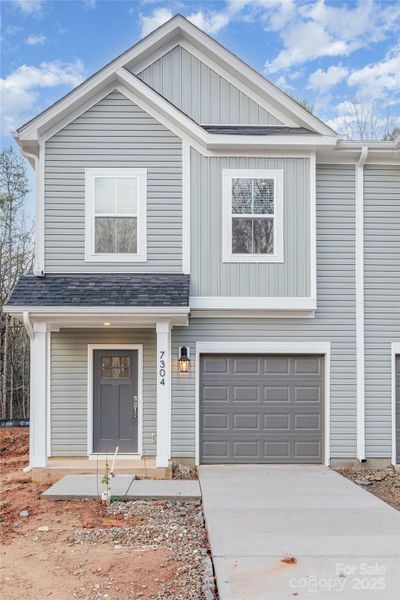Front exterior of a new home in , Charlotte, NC, highlighting curb appeal (Image 15).