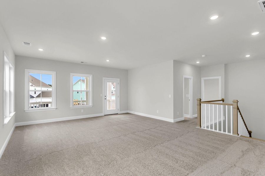 Spacious, unfurnished interior of a new home in Tidewater at Lakes of Cane Bay, Summerville (Image 28).