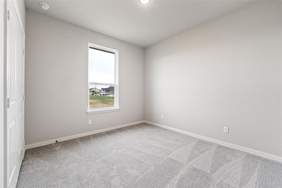 Unfurnished room featuring light carpet and recessed lighting Unfurnished room featuring light carpet and recessed lighting