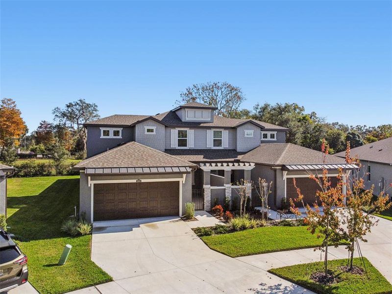 Front exterior of a new home in Villas Del Lago, Lutz, FL, highlighting curb appeal (Image 31).