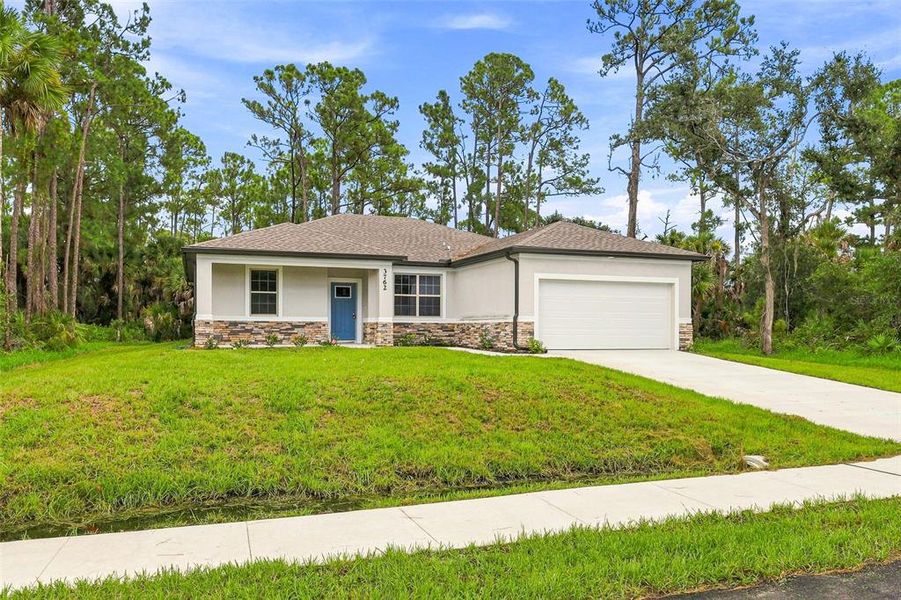 Front exterior of a new home in , North Port, FL, highlighting curb appeal (Image 16).