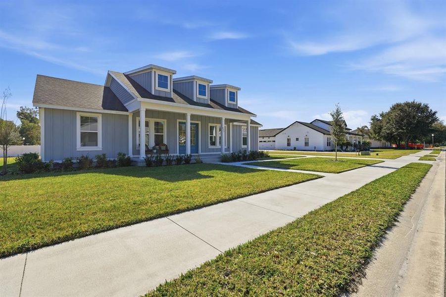 Front exterior of a new home in , Lake Helen, FL, highlighting curb appeal (Image 27).