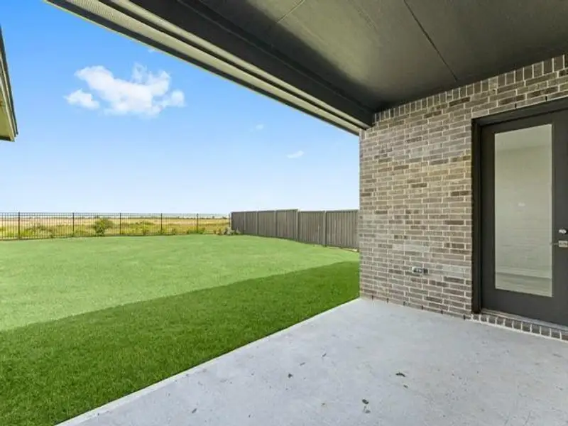 Exterior details and patio area of a home in The Grand Prairie 60’s, Hockley (Image 2).