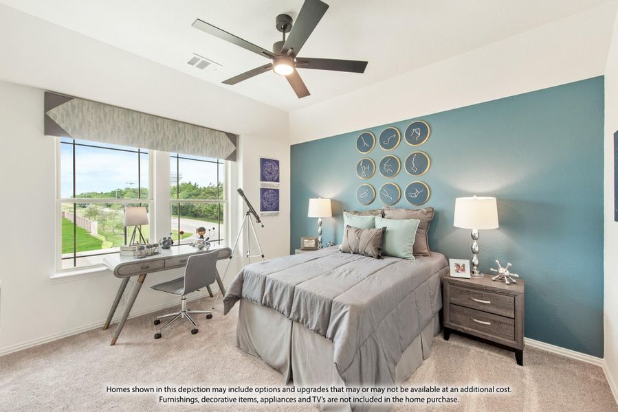 Bedroom with teal accent wall, ceiling fan, desk by window, and decorative wall art above the bed