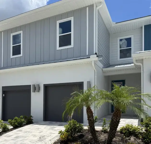 Front exterior of a new home in , Kissimmee, FL, highlighting curb appeal (Image 1). Front exterior of a new home in , Kissimmee, FL, highlighting curb appeal (Image 1).
