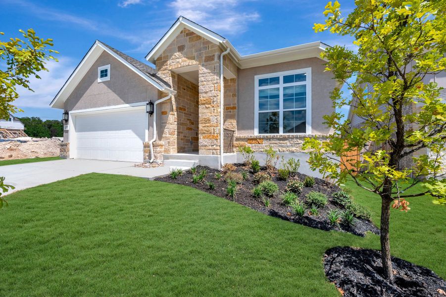 Front exterior of a new home in Davis Ranch 50', San Antonio, TX, highlighting curb appeal (Image 22). Front exterior of a new home in Davis Ranch 50', San Antonio, TX, highlighting curb appeal (Image 22).