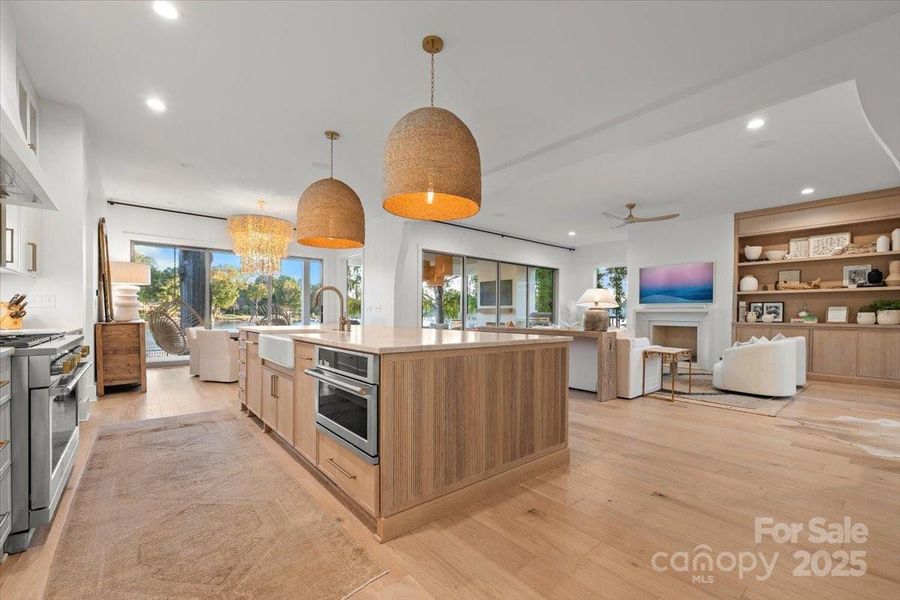 Large Center island with Farm sink, additional cabinet storage on the other side, and counter seating. Large Center island with Farm sink, additional cabinet storage on the other side, and counter seating.