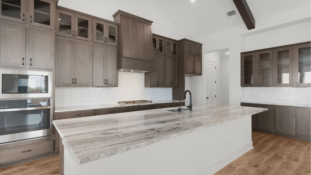 Representative furnished interior of a home built from the Drios by Chesmar Homes in Crescent Bluff, Georgetown (Image 5).