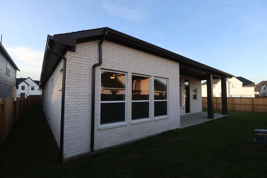 Exterior details and patio area of a home in Brookewater - Ascent Collection, Rosenberg (Image 3).
