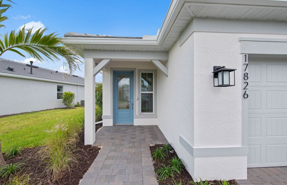 Exterior details and patio area of a home in Del Webb Oak Creek, North Fort Myers (Image 15).