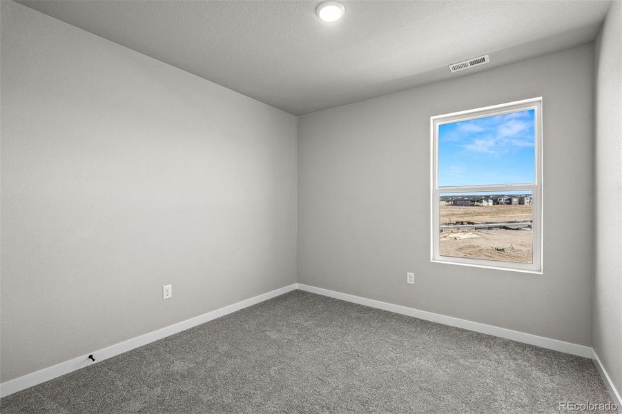 Spacious, unfurnished interior of a new home in Revel Crossing at Wolf Ranch – The Ascent Collection, Colorado Springs (Image 20).