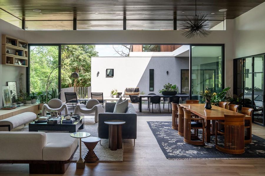 Living features 27 foot glass multi slide wall of glass the opens to the exterior living.