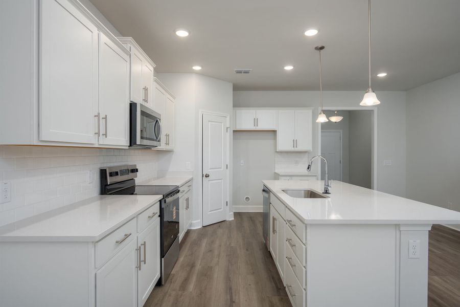 Bright Kitchen with a spacious center island. Bright Kitchen with a spacious center island.