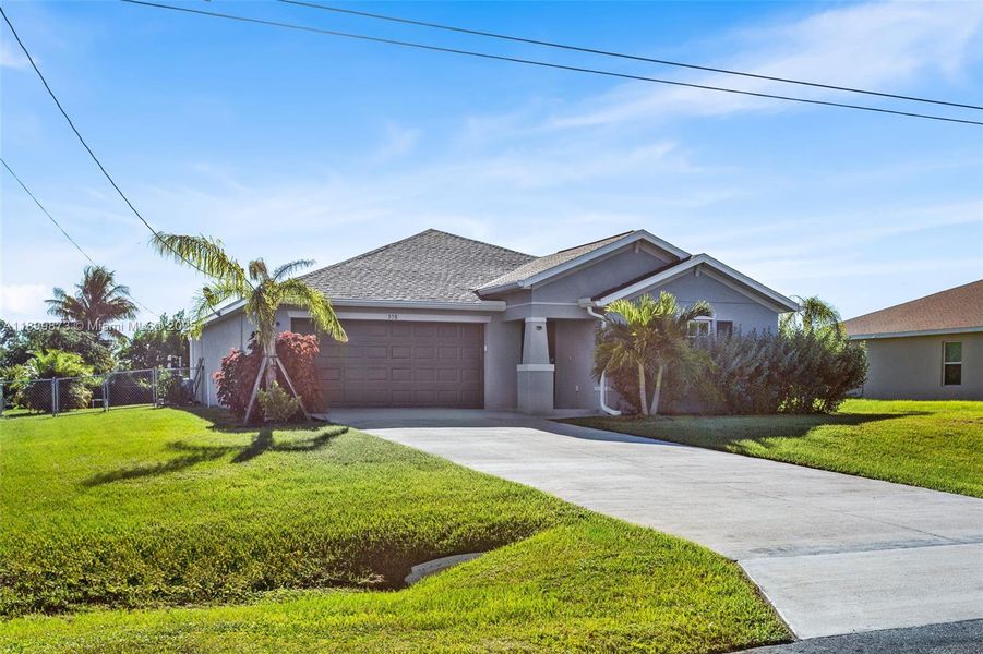 Front exterior of a new home in , Lehigh Acres, FL, highlighting curb appeal (Image 1). Front exterior of a new home in , Lehigh Acres, FL, highlighting curb appeal (Image 1).