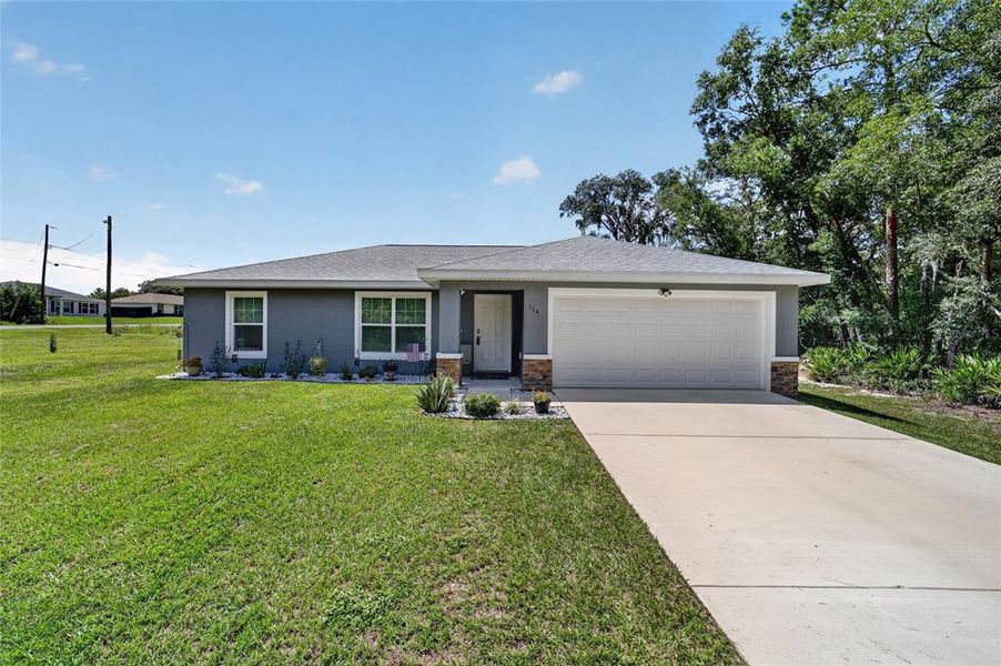 Front exterior of a new home in , Ocala, FL, highlighting curb appeal (Image 24). Front exterior of a new home in , Ocala, FL, highlighting curb appeal (Image 24).