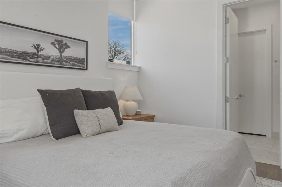 Bedroom with wood finished floors
