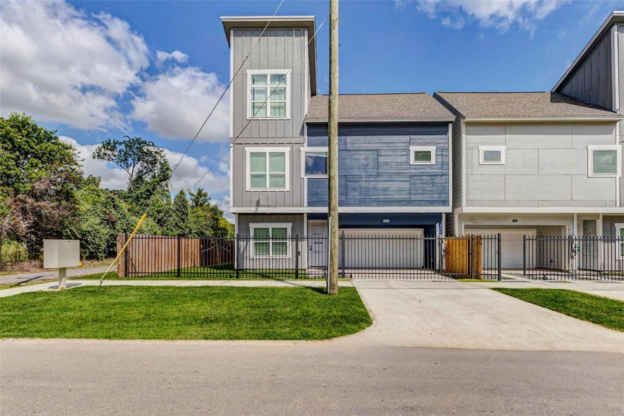 Clean, contemporary, and move-in ready. This newly built end-unit townhome features a sleek facade, a double garage, and a fenced yard perfect for those who value modern design and security. Clean, contemporary, and move-in ready. This newly built end-unit townhome features a sleek facade, a double garage, and a fenced yard perfect for those who value modern design and security.
