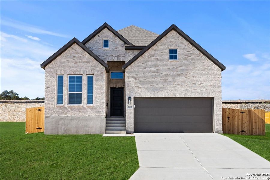 Front exterior of a new home in Meyer Ranch, New Braunfels, TX, highlighting curb appeal (Image 1). Front exterior of a new home in Meyer Ranch, New Braunfels, TX, highlighting curb appeal (Image 1).