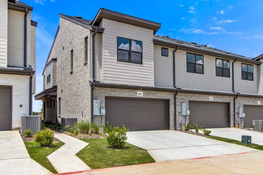 Front exterior of a new home in Wildridge, Oak Point, TX, highlighting curb appeal (Image 26).
