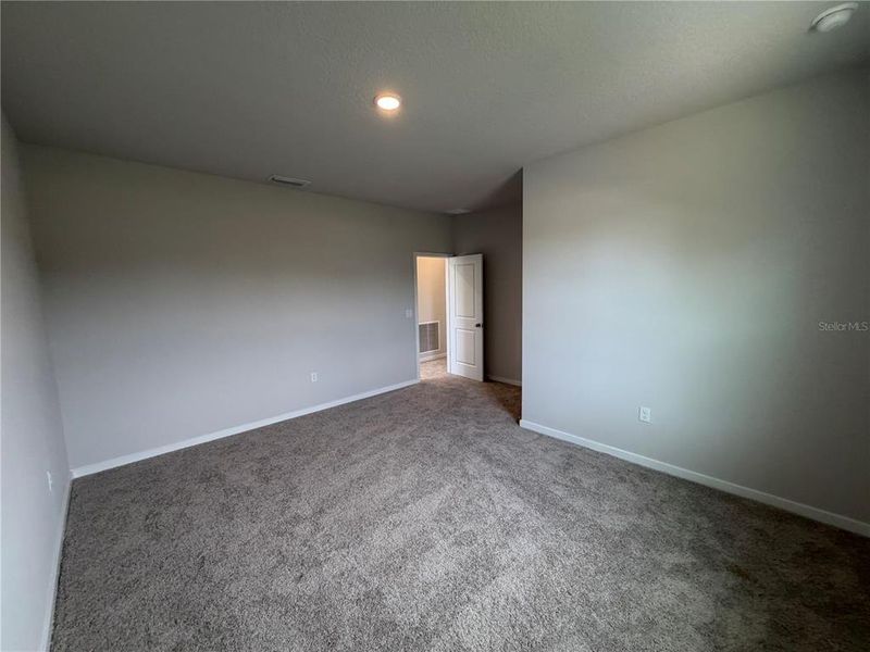 Spacious, unfurnished interior of a new home in The Cypress Series at Reserve East, Flagler Beach (Image 44).