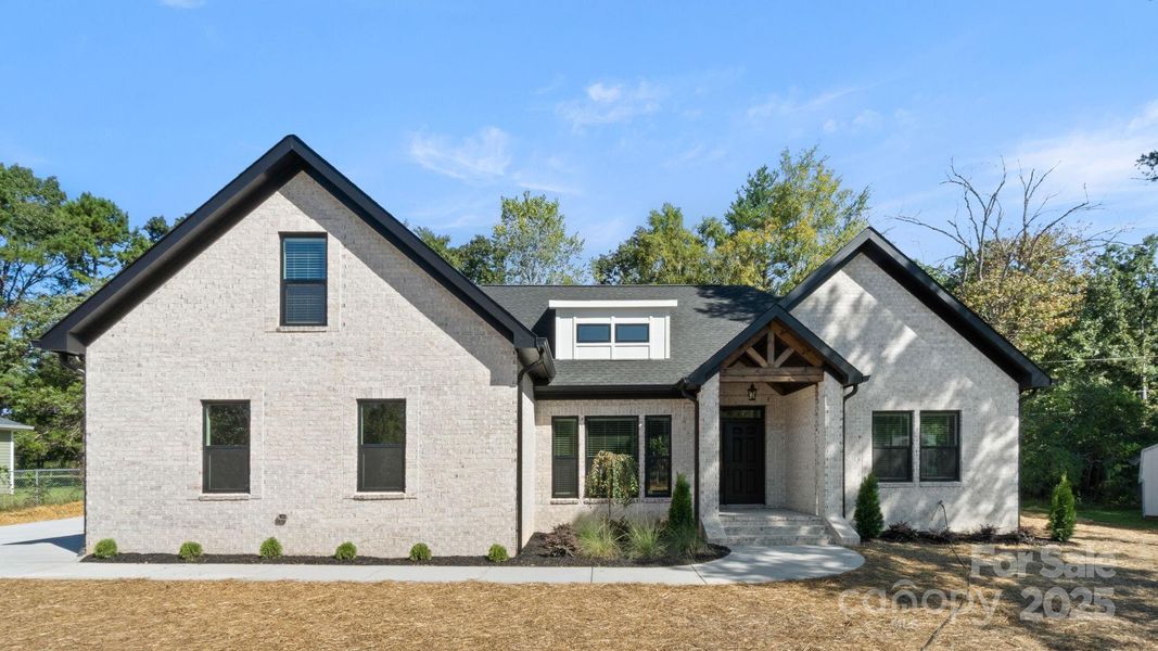 Front exterior of a new home in , Indian Trail, NC, highlighting curb appeal (Image 23). Front exterior of a new home in , Indian Trail, NC, highlighting curb appeal (Image 23).