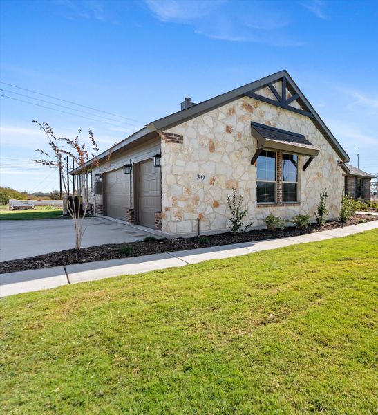 Front exterior of a new home in Parker Heights, Valley View, TX, highlighting curb appeal (Image 24). Front exterior of a new home in Parker Heights, Valley View, TX, highlighting curb appeal (Image 24).