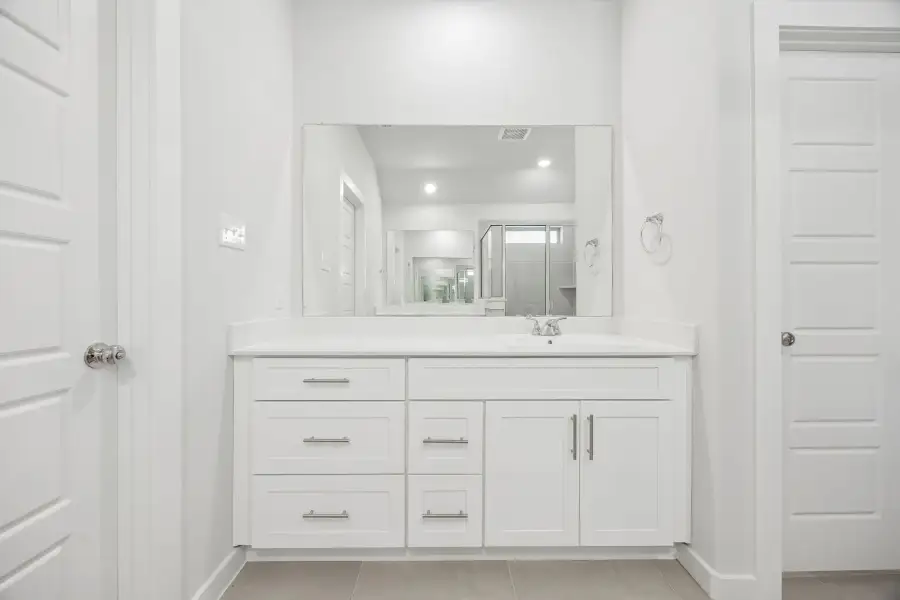 Primary bathroom in the Heisman home plan by Trophy Signature Homes – REPRESENTATIVE PHOTO