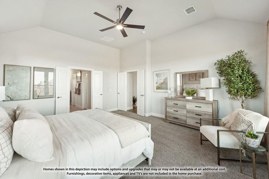 Master bedroom with vaulted ceiling, ceiling fan, carpet floors, and doors leading to ensuite bathroom and walk-in closet Master bedroom with vaulted ceiling, ceiling fan, carpet floors, and doors leading to ensuite bathroom and walk-in closet