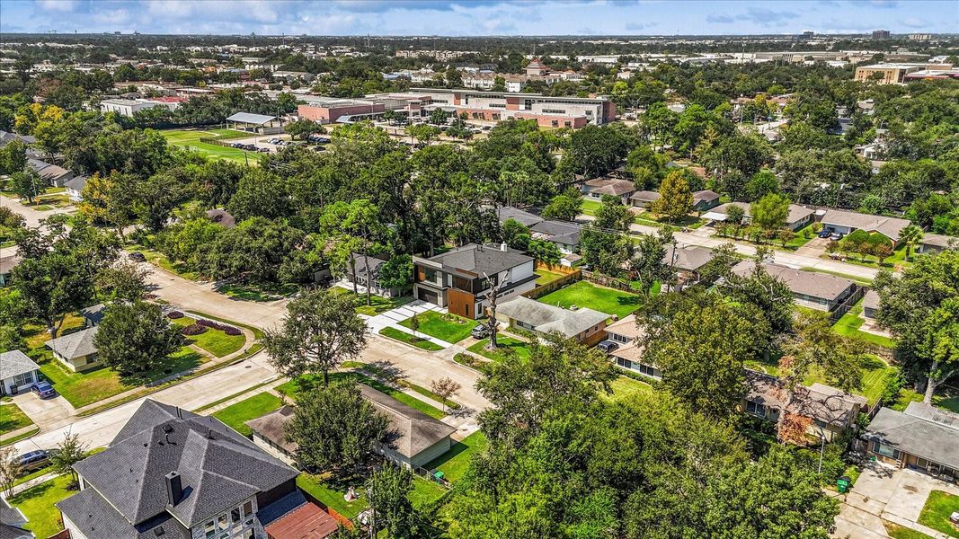 Stunning aerial view showcasing the lush greenery and inviting neighborhood, highlighting the home's prime location and charming surroundings. Stunning aerial view showcasing the lush greenery and inviting neighborhood, highlighting the home's prime location and charming surroundings.