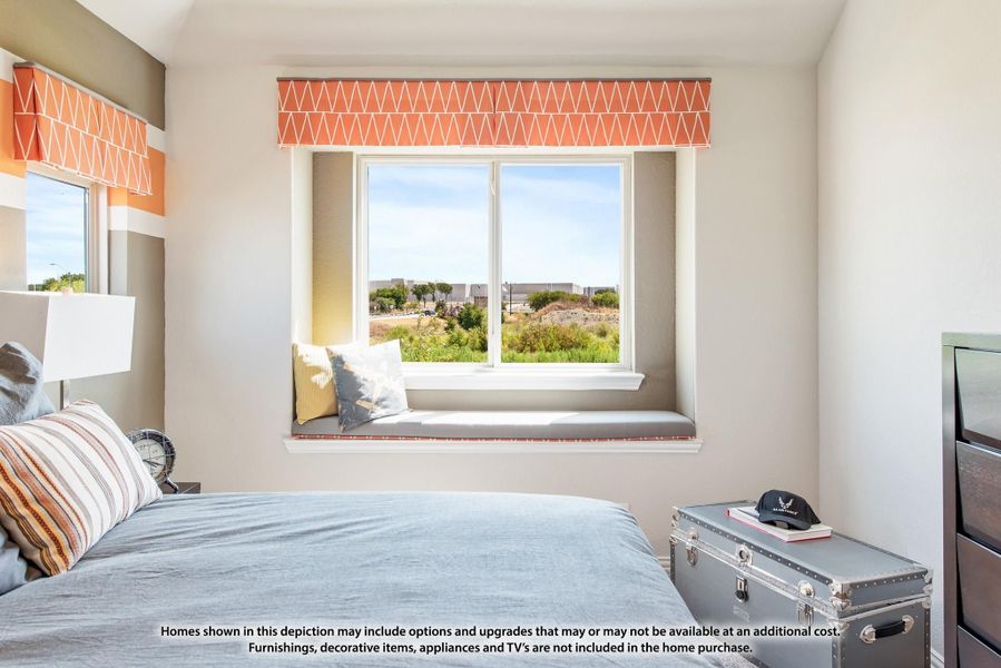 Bedroom with built-in window seat, orange valance curtains, and a view of open landscape outside Bedroom with built-in window seat, orange valance curtains, and a view of open landscape outside