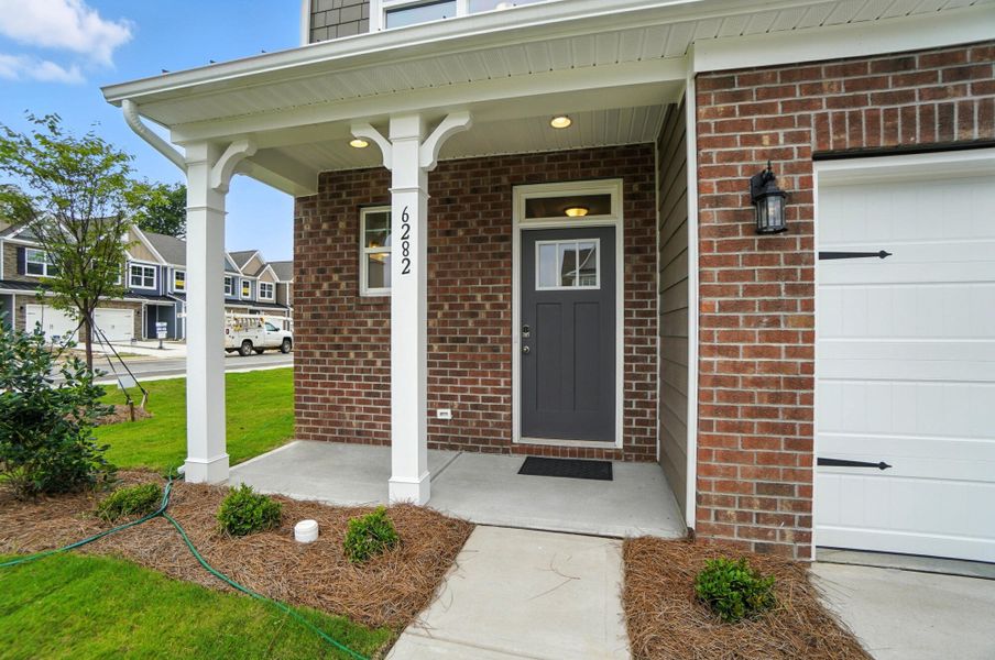 Front exterior of a new home in Harrisburg Village Townhomes, Harrisburg, NC, highlighting curb appeal (Image 28). Front exterior of a new home in Harrisburg Village Townhomes, Harrisburg, NC, highlighting curb appeal (Image 28).