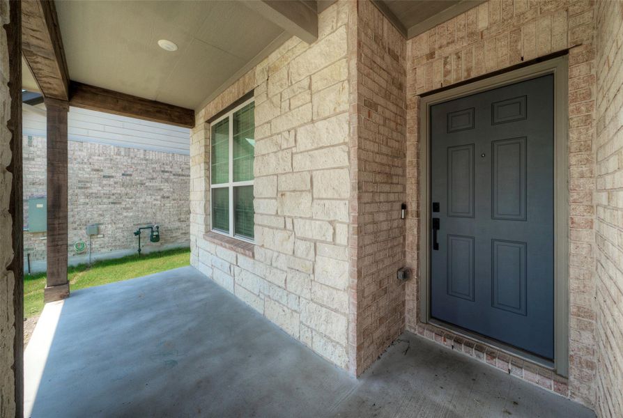 A welcoming front porch features sturdy wood columns and brick construction. A welcoming front porch features sturdy wood columns and brick construction.