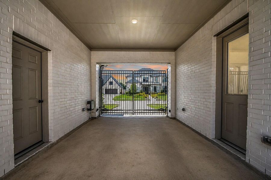 Convenient porte cochere with motorized automatic driveway gate. The door on your right leads to the mud room and kitchen. This porte cochere is great for unloading groceries when it's raining. Convenient porte cochere with motorized automatic driveway gate. The door on your right leads to the mud room and kitchen. This porte cochere is great for unloading groceries when it's raining.