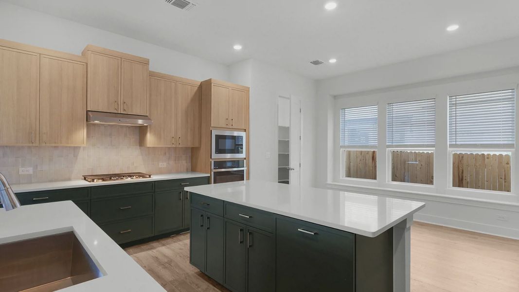 Representative furnished interior of a home built from the Archer by Chesmar Homes in Santa Rita Ranch, Liberty Hill (Image 9).