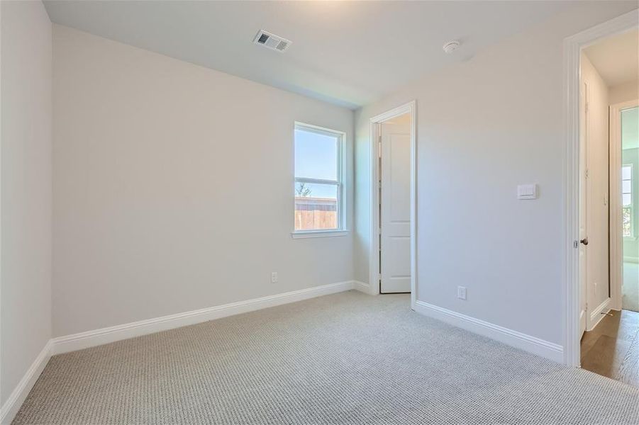 Empty room with carpet flooring