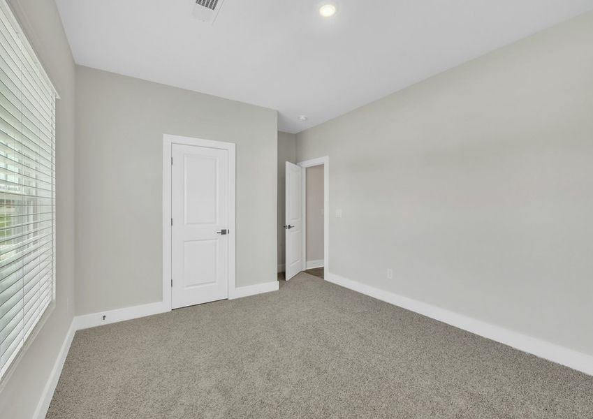 The secondary bedroom has lots of space.