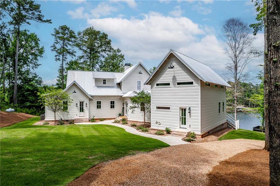 Front exterior of a new home in , Eatonton, GA, highlighting curb appeal (Image 1). Front exterior of a new home in , Eatonton, GA, highlighting curb appeal (Image 1).