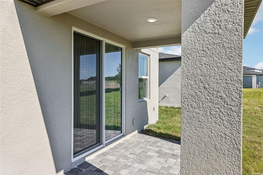 Exterior details and patio area of a home in The Reserve at Hammock Oaks - Classic Series, Lady Lake (Image 28).