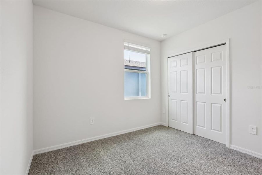 Spacious, unfurnished interior of a new home in Lake Deer Estates - Signature Series, Poinciana (Image 26).