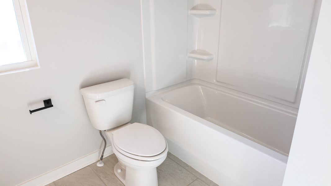 Representative furnished interior of a home built from the STONEBROOK II by D.R. Horton in Harvest Point, Spring Hill (Image 17).