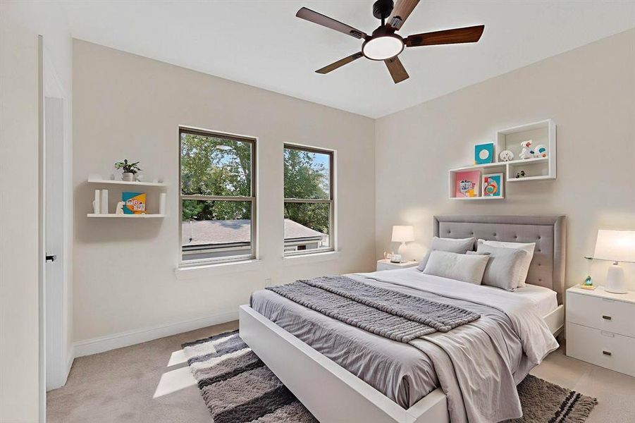 Bedroom with light colored carpet and ceiling fan Bedroom with light colored carpet and ceiling fan