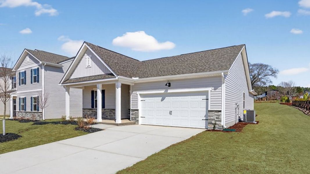 Front exterior of a new home in Tyler - Home on the Lake, New Bern, NC, highlighting curb appeal (Image 20). Front exterior of a new home in Tyler - Home on the Lake, New Bern, NC, highlighting curb appeal (Image 20).